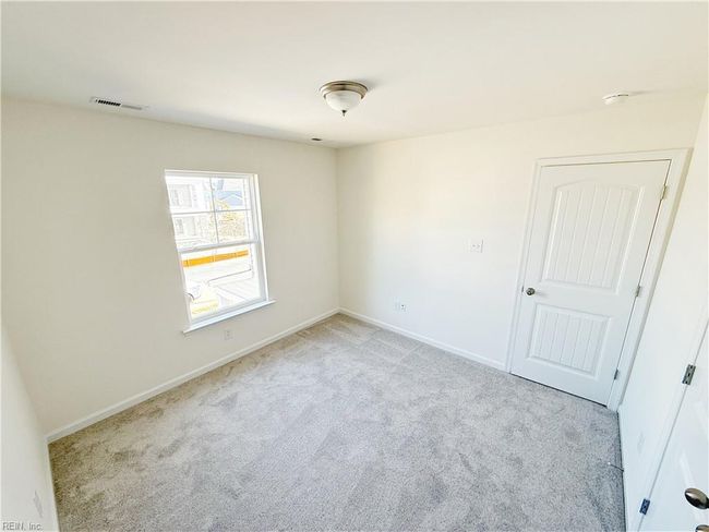 Upstairs you’ll find two additional bedrooms with carpet and double door closets. | Image 11