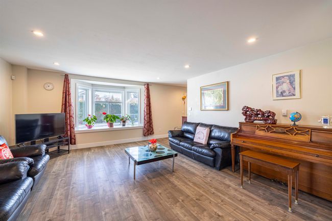 Living area featuring recessed lighting, baseboards, and wood finished floors | Image 6