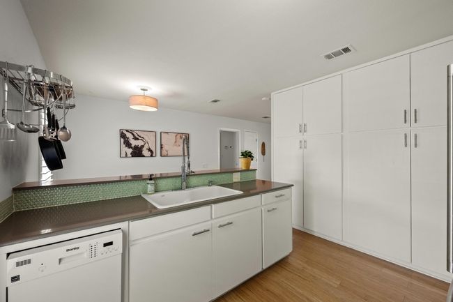 The kitchen offers soft close cabinets. | Image 11