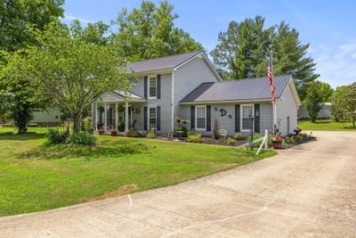 Another view from driveway showing how large the driveway is and parking in back | Image 2