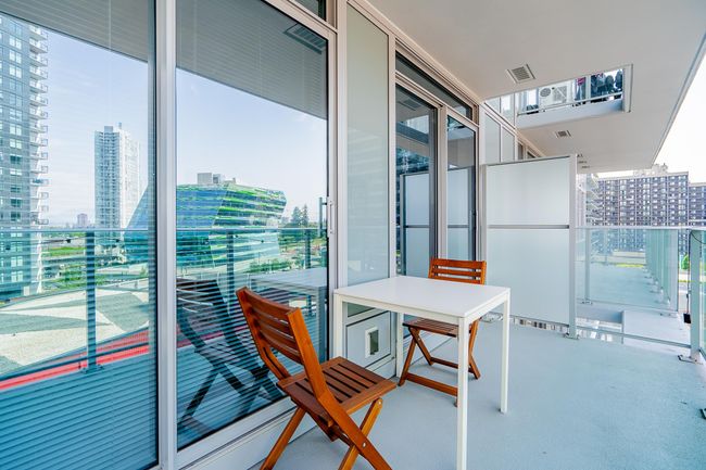 Balcony with visible vents and a view of city | Image 19