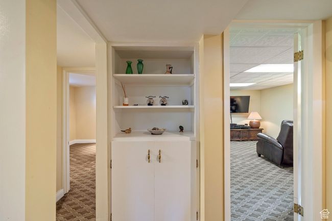 Corridor with carpet flooring and built in features | Image 20