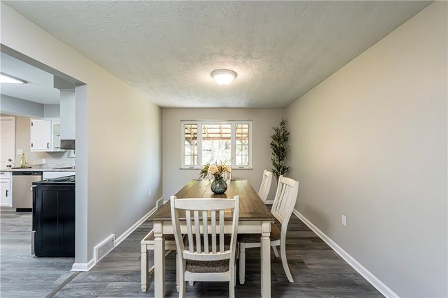 You'll enjoy hosting larger gatherings with plenty of room to add tables into the living room area. | Image 11