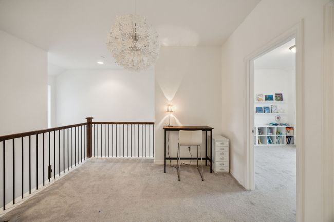 Corridor featuring an inviting chandelier and carpet | Image 14