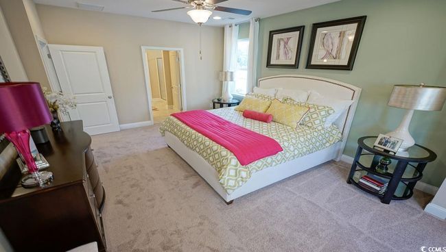 Bedroom with carpet floors, baseboards, ensuite bathroom, and a ceiling fan | Image 22