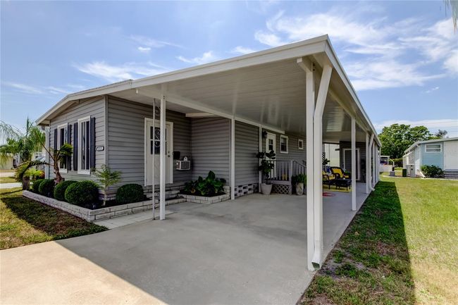 12. Brand New Carport - It Was the ONLY Damage from Storms.. Spacious for Your Car & a Comfortable Seating Area! | Image 12