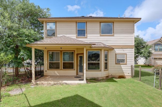 Also enjoy a peaceful covered back porch and your own private fenced-in backyard. | Image 5