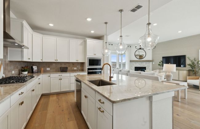 Spacious kitchen with large island *Photos of furnished model. Not actual home. Representative of floor plan. Some options and features may vary | Image 12