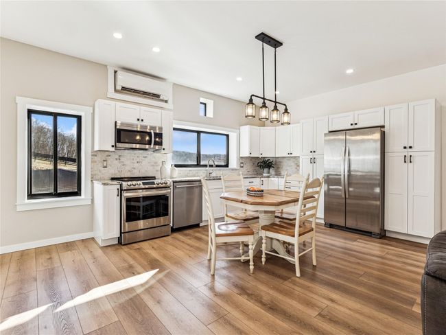 Kitchen featuring stainless steel appliances and energy efficiency commercial grade HVAC | Image 10