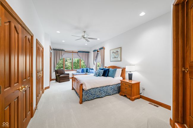 bedroom with light colored carpet, visible vents, ceiling fan, baseboards, and recessed lighting | Image 85