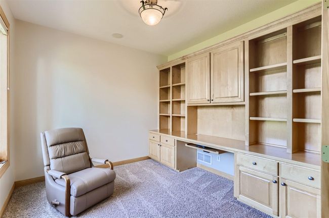 Working remotely? This office is PERFECT for you! Has big windows to let in sunlight and plenty of desk and shelf space! Makes working from home not so bad! | Image 13