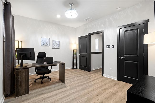 Home office featuring light wood-style flooring and baseboards | Image 20