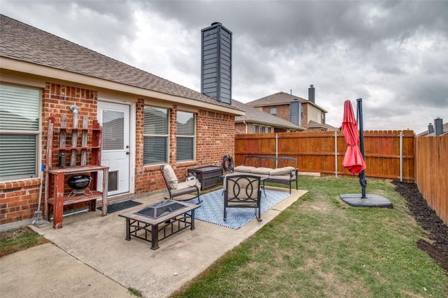 View of patio / terrace featuring an outdoor living space with a fire pit | Image 23