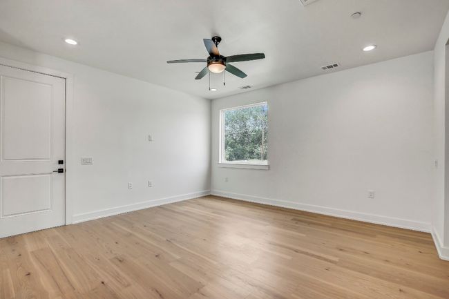 Unfurnished room with ceiling fan, light wood-type flooring, baseboards, and recessed lighting | Image 11