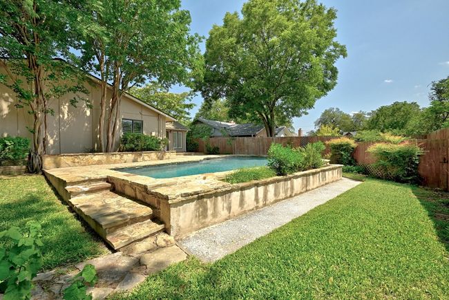 View of the yard area around the pool | Image 35