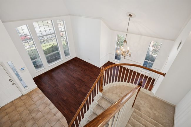 Dramatic view of Living Room & Dining Room from upstairs landing | Image 10