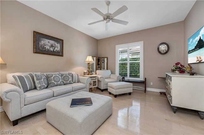 3rd Bedroom currently functions as a sitting room as part of a mini suite | Image 12