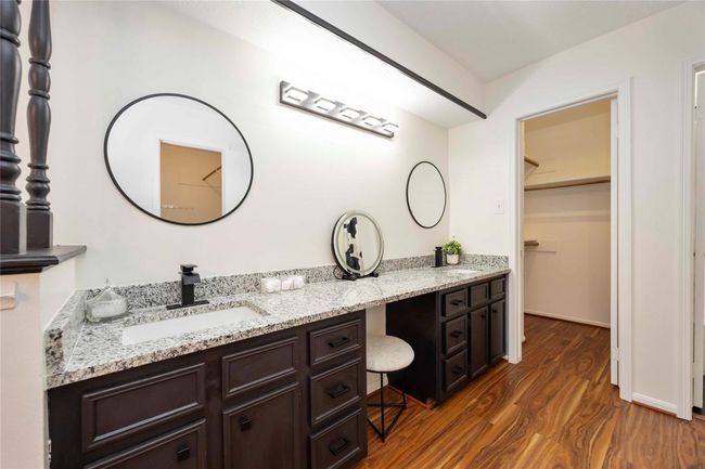 A dual-sink vanity area located in a second-floor bedroom, conveniently positioned next to a spacious closet. | Image 17