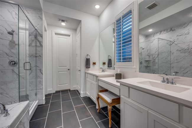 Bathroom featuring a stall shower, vanity, visible vents, and tile patterned floors | Image 15