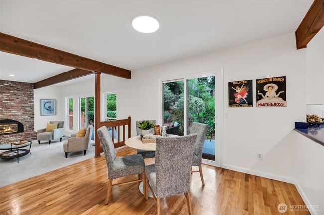 Enjoy informal dining in the kitchen's charming eating space which overlooks the park like back yard | Image 12