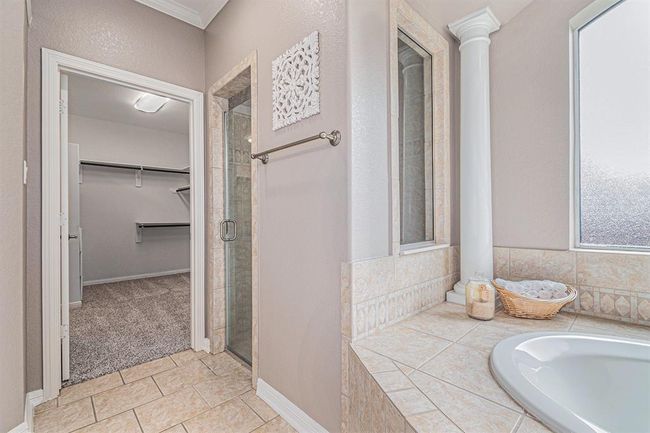 A partially glass enclosed shower offers a bit of modesty with a window that will allow in natural light too! | Image 22