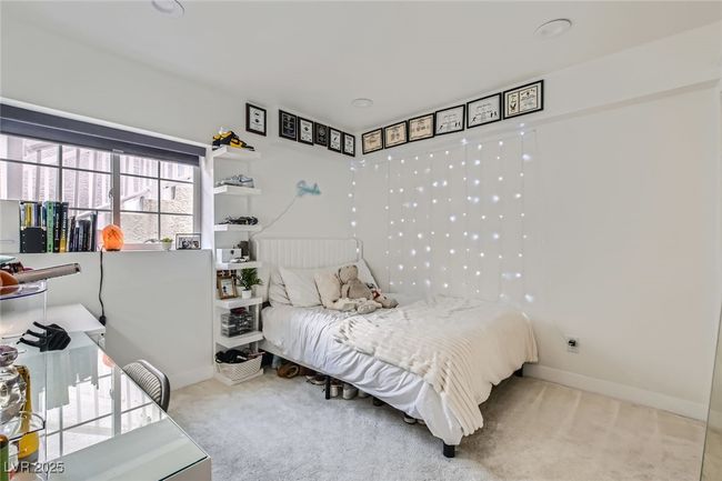 Carpeted bedroom featuring baseboards | Image 22