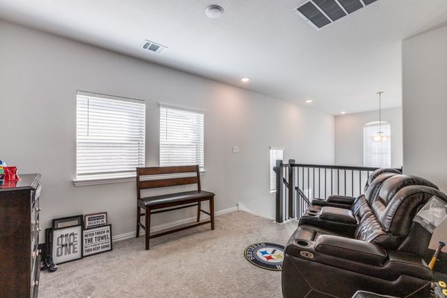 Living area featuring an upstairs landing, healthy amount of natural light, carpet, and recessed lighting | Image 16