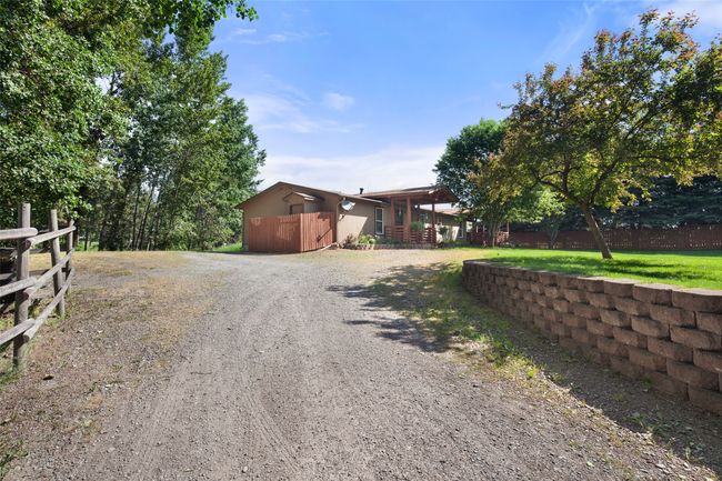 View of front of home with gravel driveway | Image 55