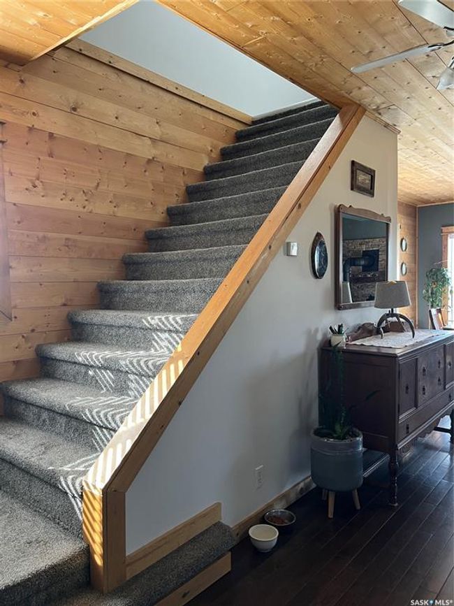 Staircase with wood ceiling, hardwood / wood-style floors, and baseboards | Image 22