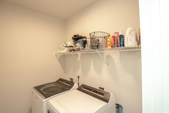 Clothes washing area featuring independent washer and dryer | Image 35