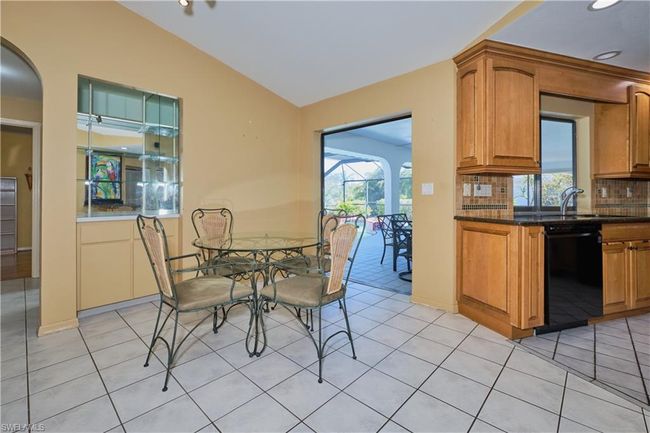 Dining Area with open floor plan to living room and kitchen. | Image 14