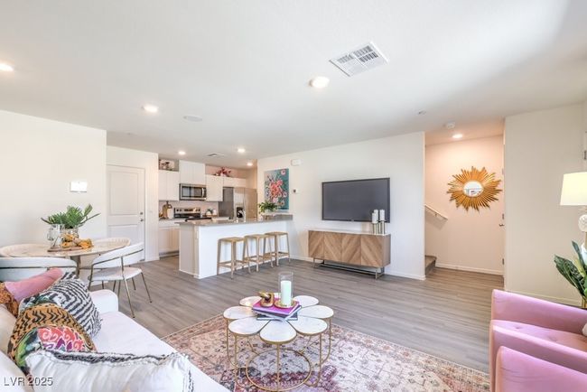 Living room with recessed lighting, visible vents, light wood-style flooring, and baseboards | Image 7