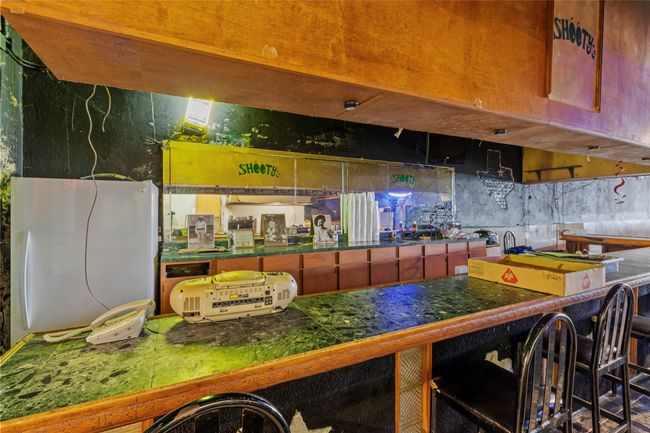 Kitchen featuring a kitchen breakfast bar and white fridge | Image 18