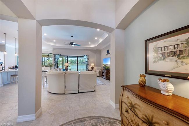 Arched entryway showing full pond/waterfall views. | Image 4