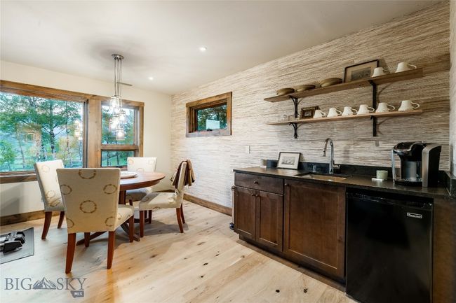 The Upper level family room with a kitchenette is situated in the guest wing. | Image 39