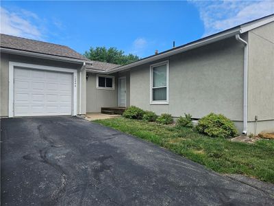 Single story home featuring a garage | Image 1