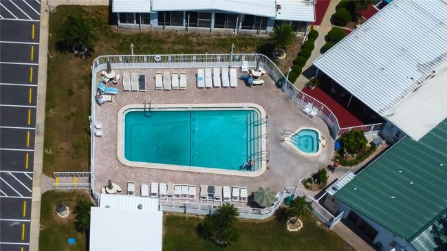 56. A Sparkling Pool & Spa is Heated for Year Round Use is One of MANY Amenities in Golden Gate! | Image 55