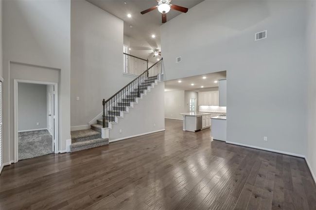 Very open floor plan with high ceilings and a seamless transition to the kitchen area. | Image 11