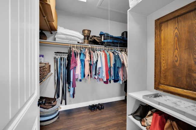 Spacious closet featuring dark hardwood / wood-style flooring | Image 19