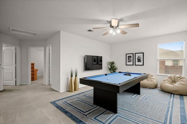 Recreation room featuring light carpet, a ceiling fan, and pool table | Image 10