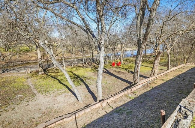 Backyard with tiered levels down to lake | Image 33