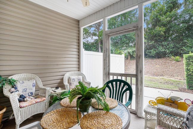 Sunroom with a ceiling fan | Image 26