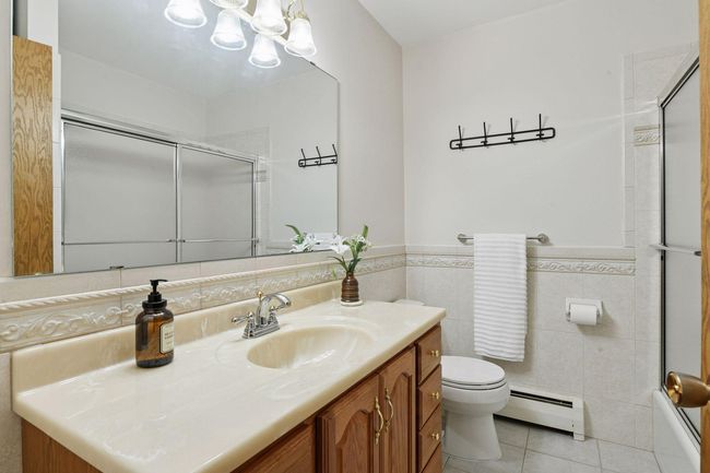 An immaculate ceramic tile FULL bathroom ready for a warm bubble bath after you played all day on Lake Minnetonka. | Image 26