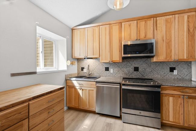 Hickory cabinets and stainless steel appliances | Image 6