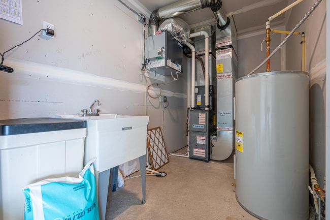 Utility room, water-softener owned, electric water heater and forced air, 200 amp service. | Image 23