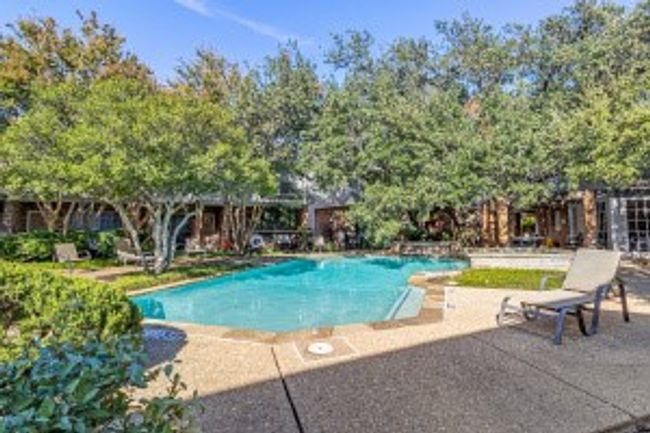 Swimming pool with a patio area | Image 16