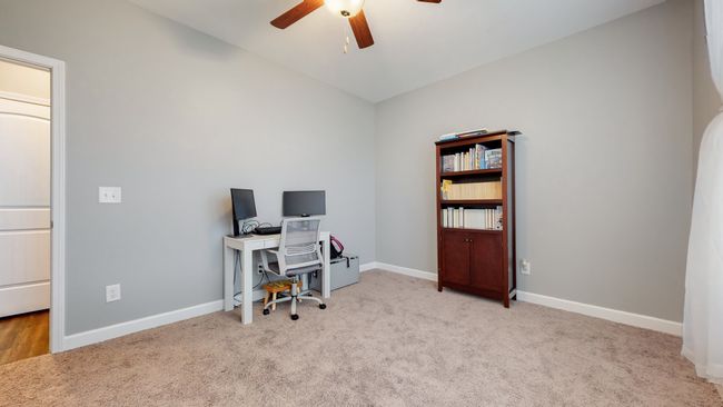 Main level bedroom is being used as an office | Image 21