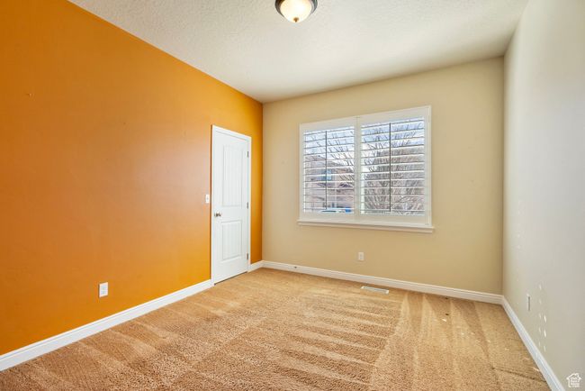 Empty room with carpet, baseboards, and a textured ceiling | Image 21