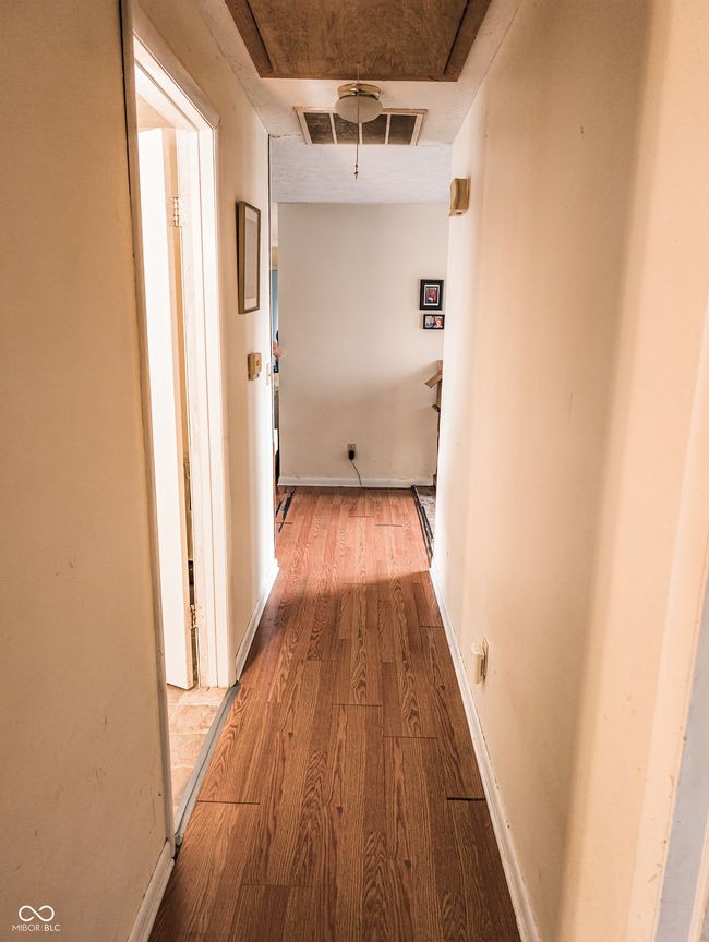 hallway featuring wood finished floors | Image 12