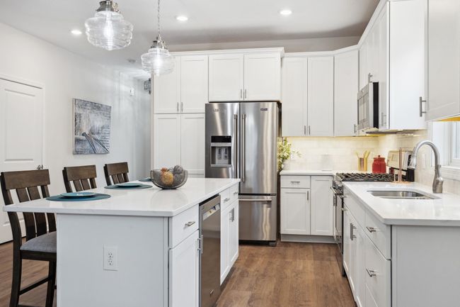 Open concept kitchen with a spacious island. | Image 6